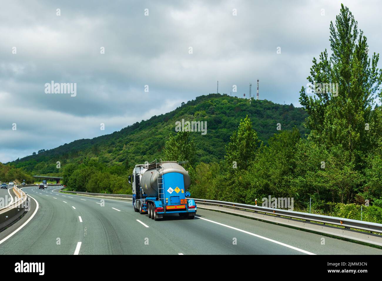 Powder tanker truck loaded with dangerous goods, danger due to combustion and polluting the environment, Stock Photo