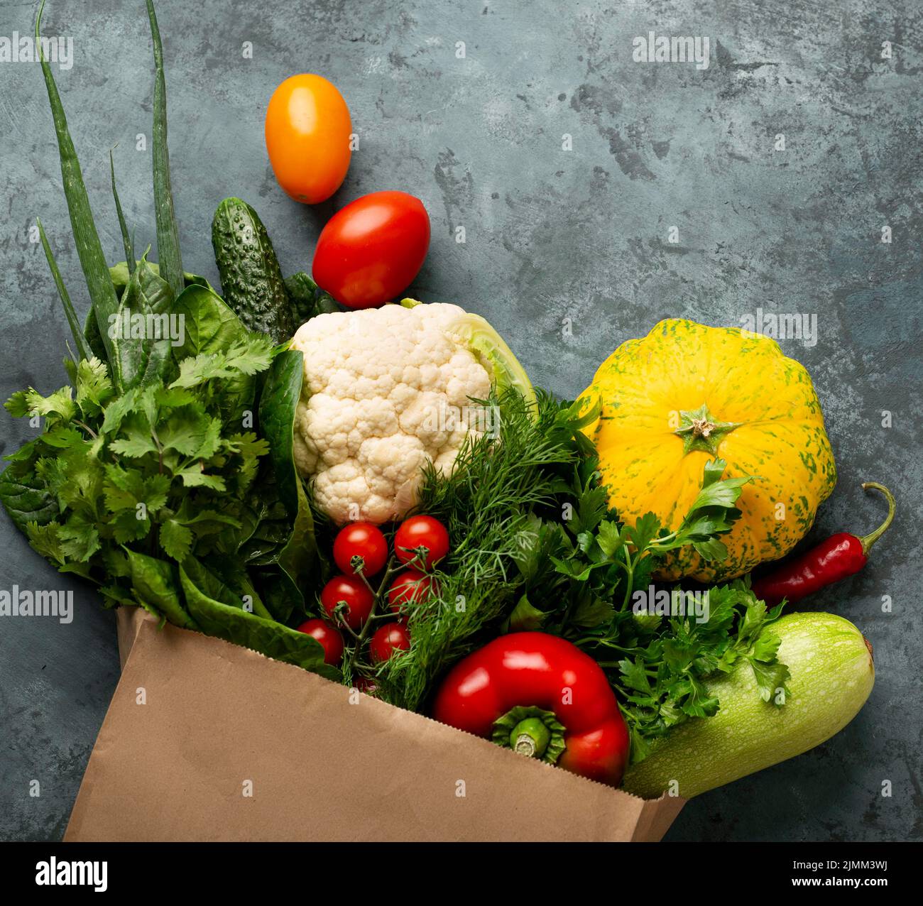 Flat lay vegetables stucco background Stock Photo