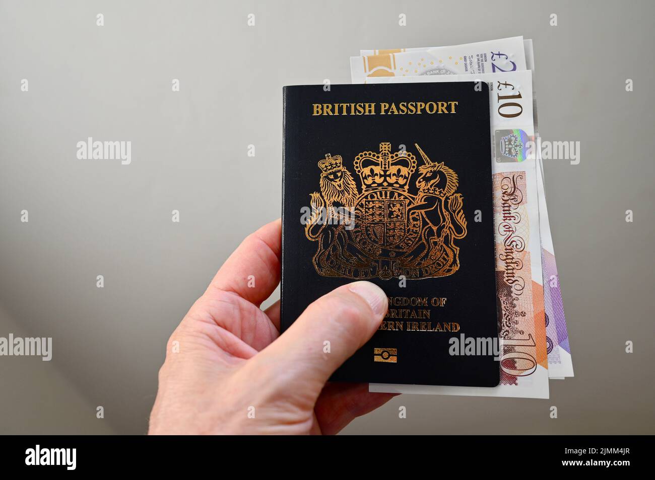 New British Blue Passport with banknotes enclosed Stock Photo Alamy