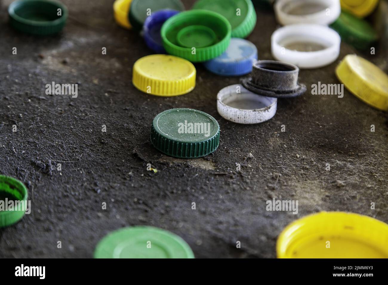 Dirty plastic caps in barrel, recycling and environment Stock Photo Alamy