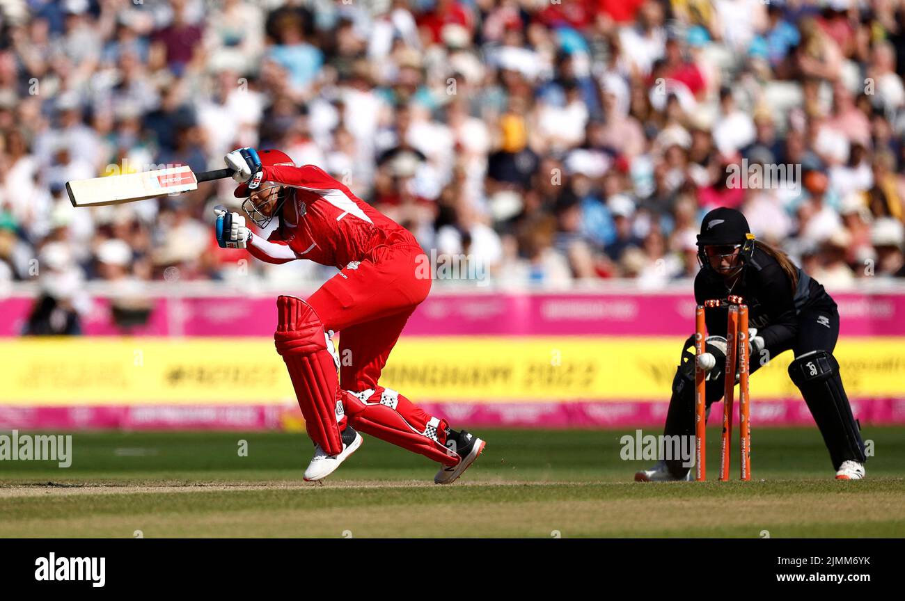 Commonwealth Games - Women's Cricket T20 - England v New Zealand - Bronze Medal - Edgbaston Stadium, Britain - August 7, 2022 England's Sophia Dunkley is bowled out by New Zealand's Amelia Kerr REUTERS/Jason Cairnduff Stock Photo