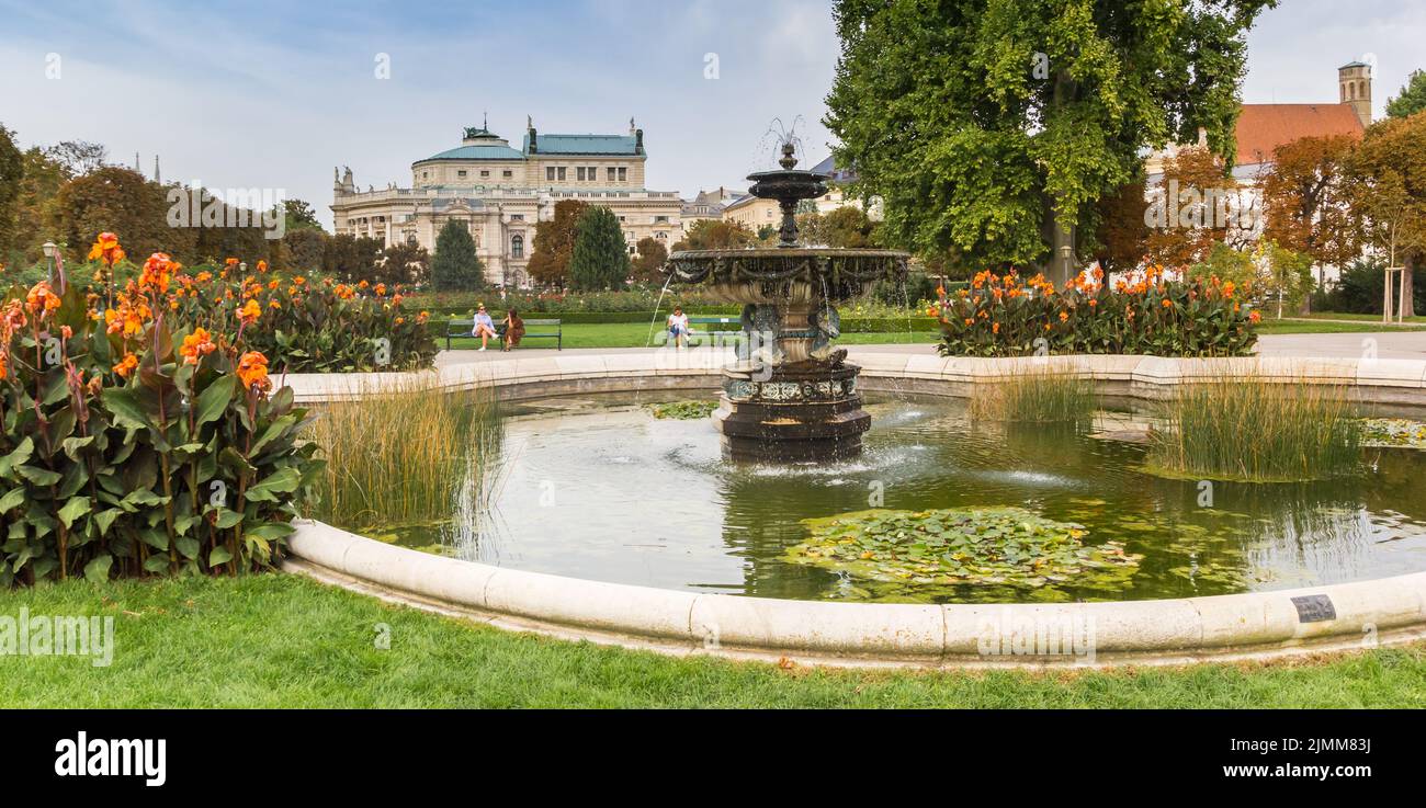 Panorama of a fountain and flowers in the Volksgarten park of Vienna, Austria Stock Photo