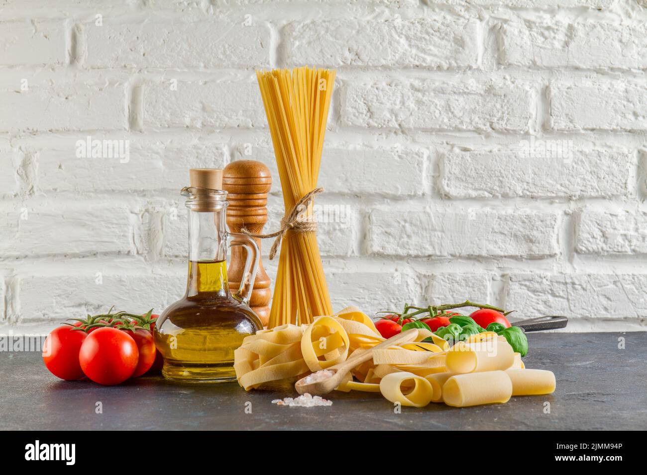Surface with different types pasta tomatoes oil Stock Photo