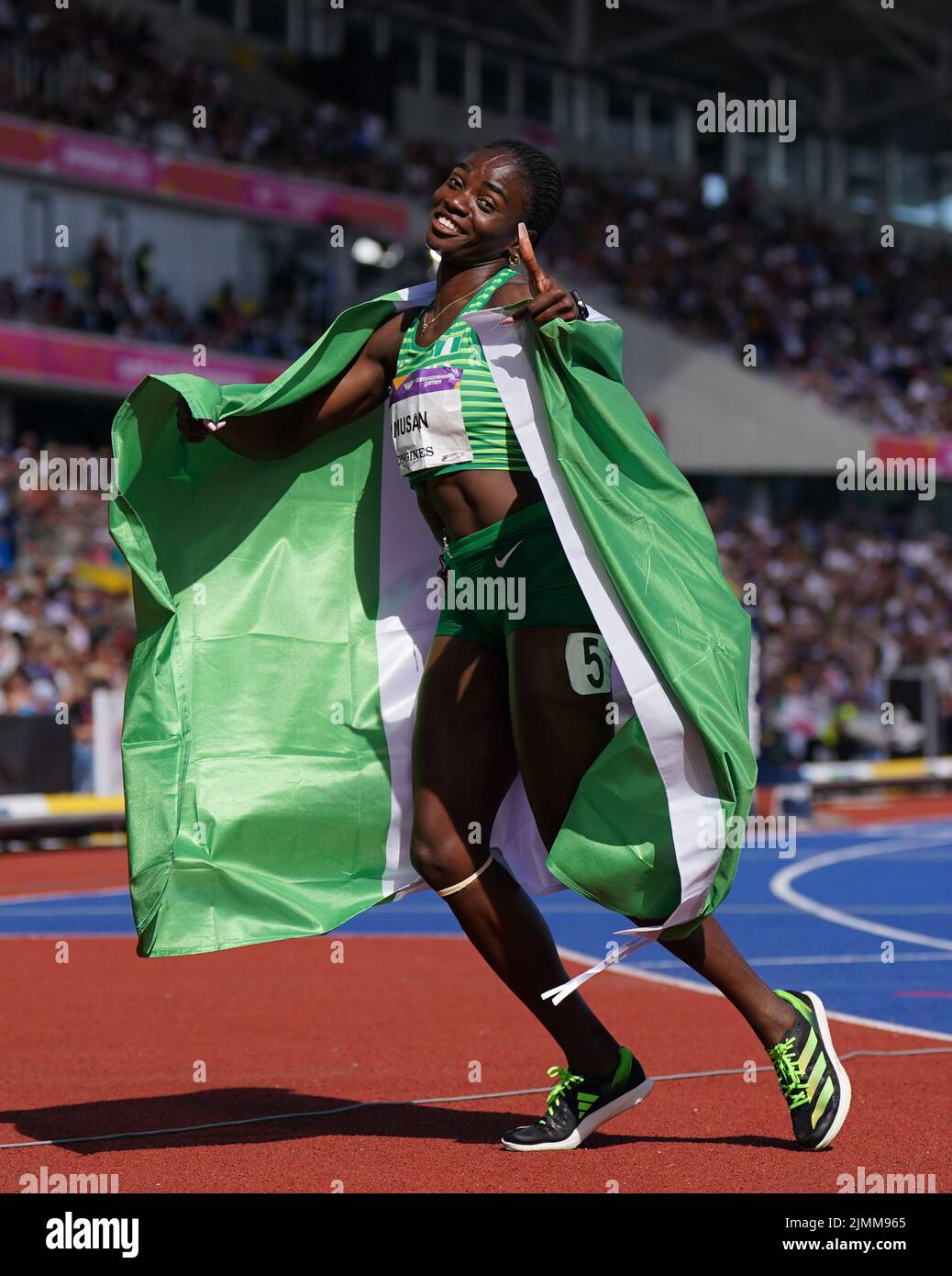 Nigeria's Tobi Amusan celebrates after winning the Women's 100m Hurdles - Final at Alexander Stadium on day ten of the 2022 Commonwealth Games in Birmingham. Picture date: Sunday August 7, 2022. Stock Photo
