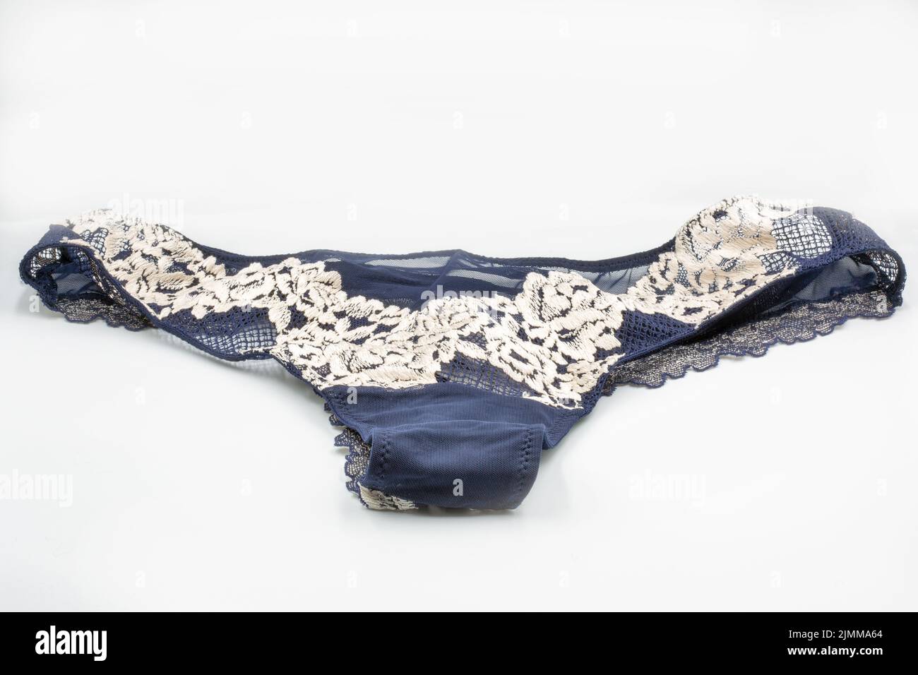 Blue lace panties closeup on white. Lingerie, female lace lingerie, womans erotic panties. Stock Photo