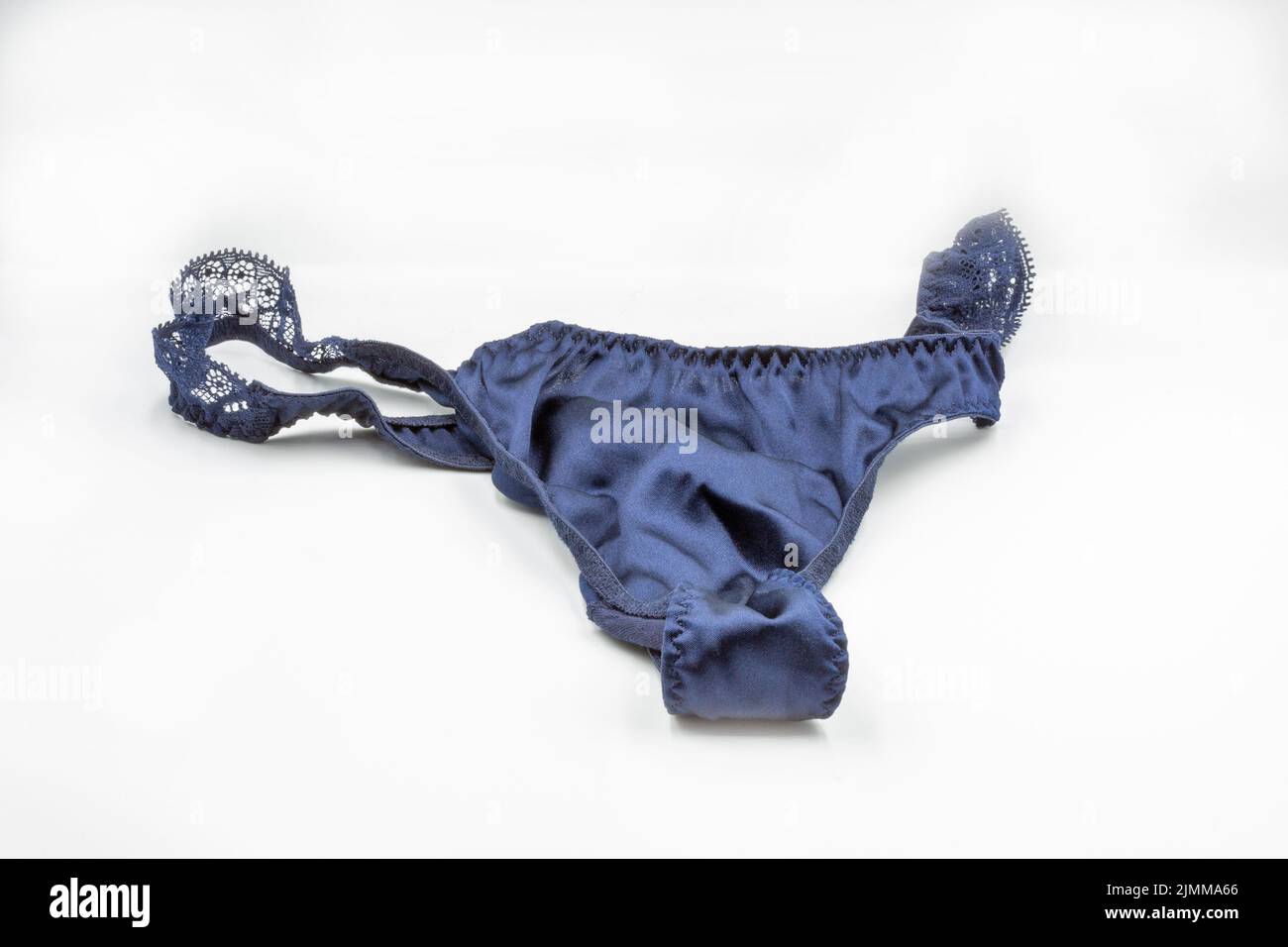 Blue lace panties closeup on white. Lingerie, female lace lingerie, womans erotic panties. Stock Photo
