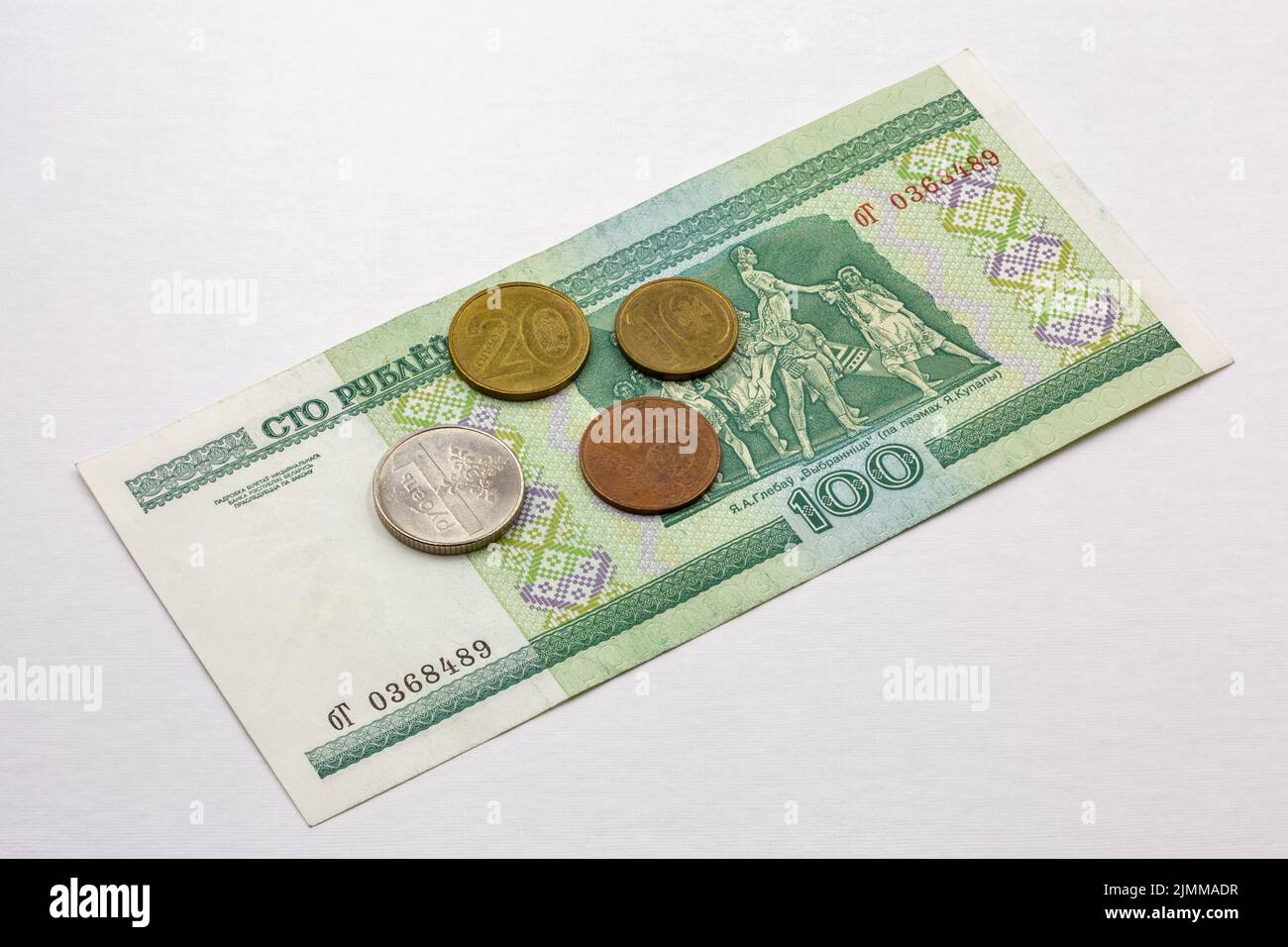 Belarusian paper money banknote and coins closeup against white Stock Photo