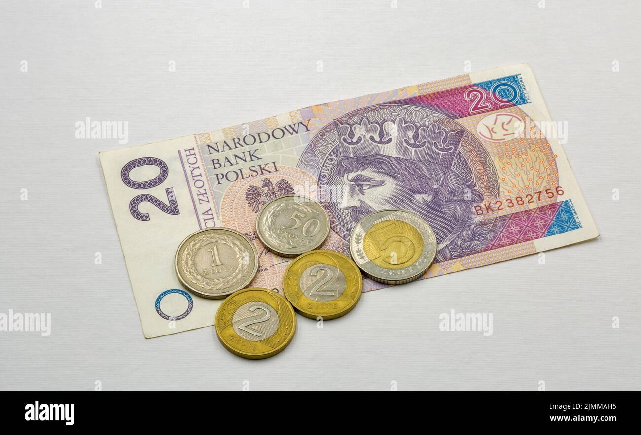 Polish twenty zloty fifty banknote and coins closeup against white Stock Photo