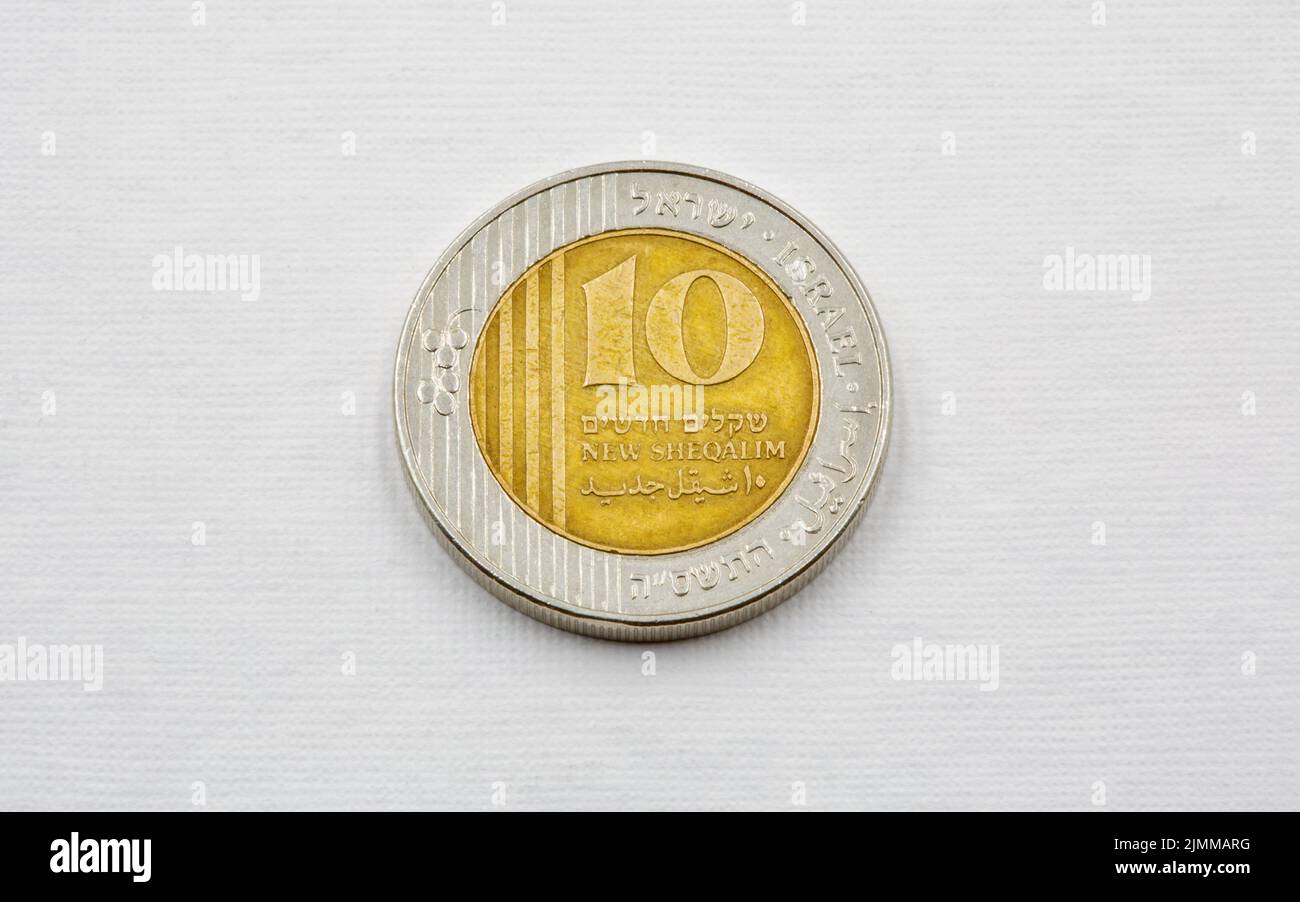 Modern Israeli coin ten sheqel used closeup on the white background Stock Photo