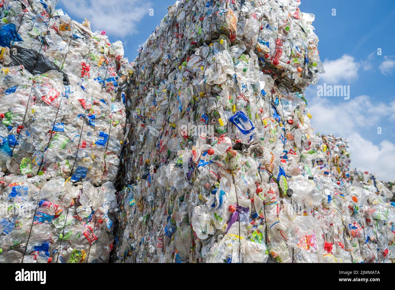 Collected Compacted and Ready For Recycling Process Plastic PET Bottles. Piles of Plastic Waste For Reprocessing. Stock Photo
