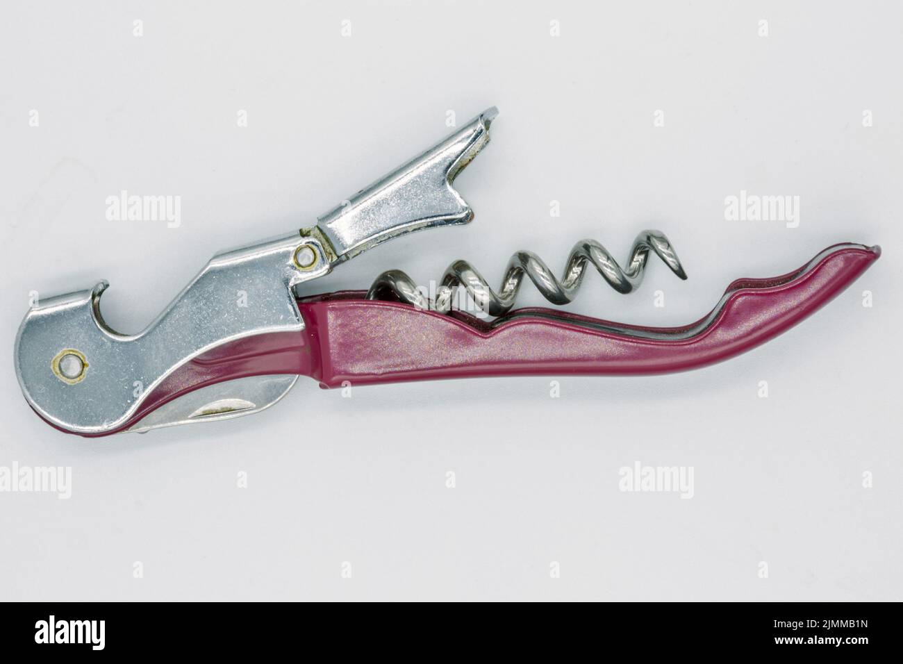Wine bottle corkscrew closeup against white Stock Photo Alamy