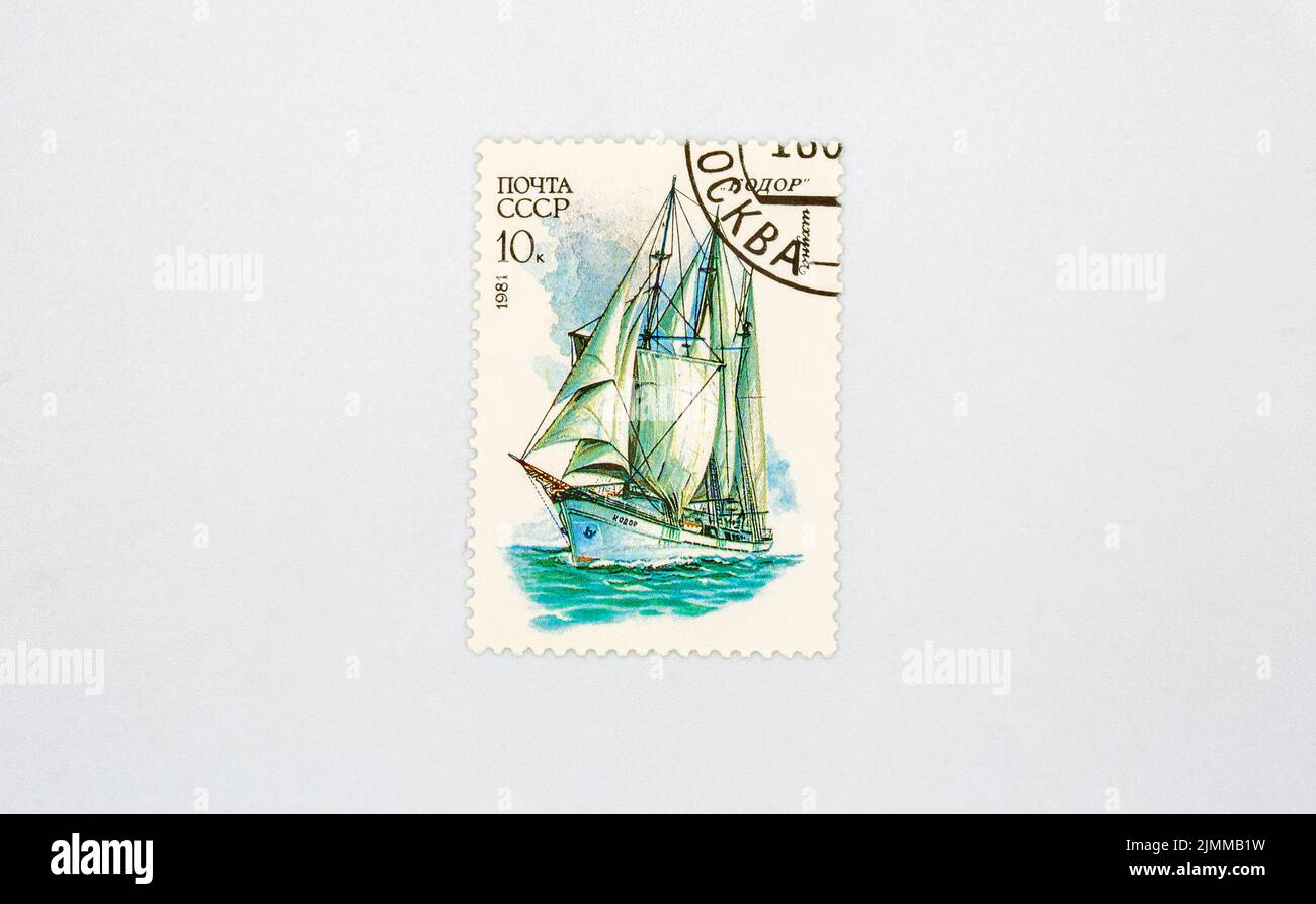 Old collectible stamp of the USSR Post with the schooner Kodor closeup against white. Circa 1981. Stock Photo