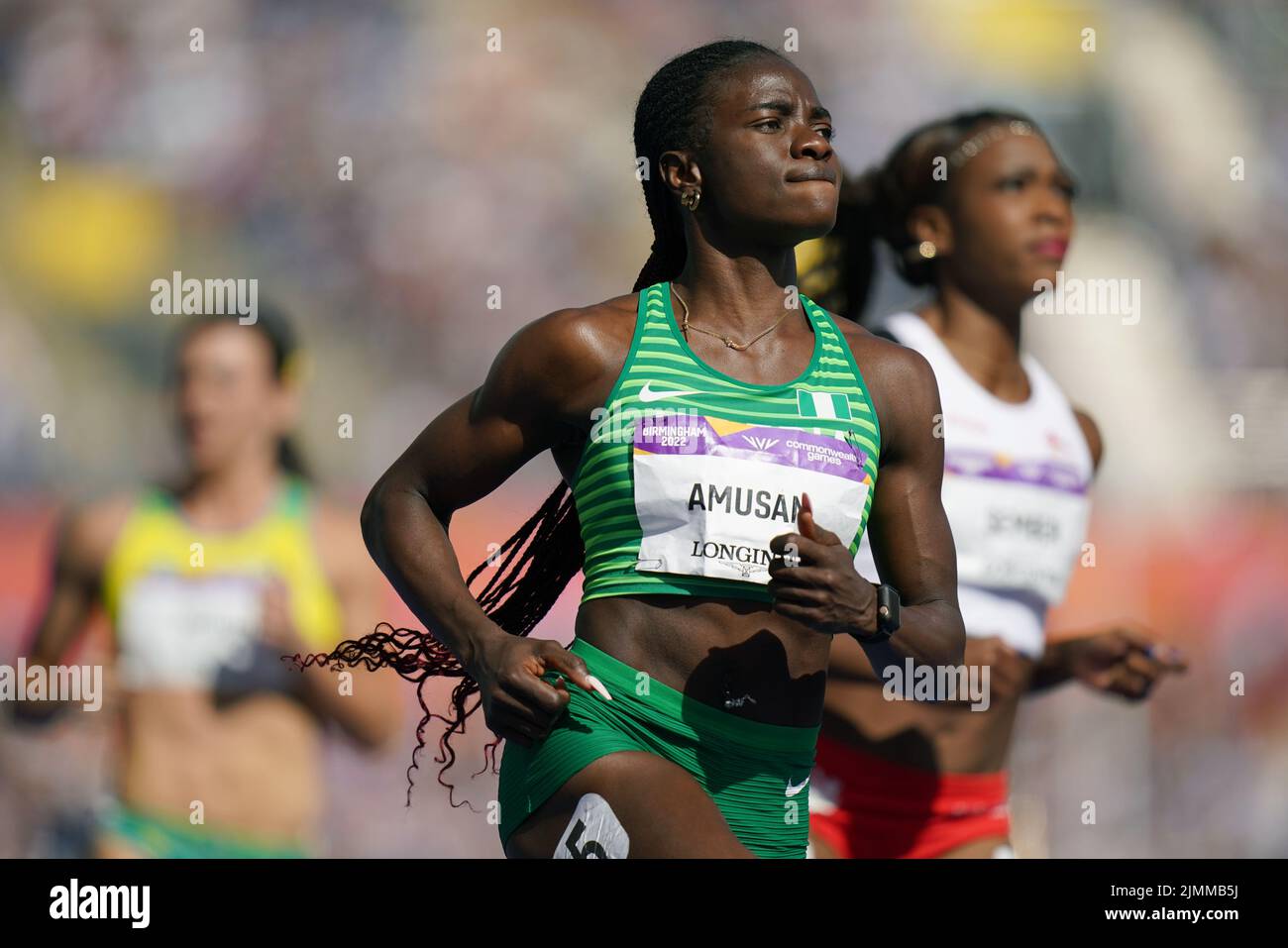Nigeria's Tobi Amusan (centre) after winning the Women's 100m Hurdles - Final at Alexander Stadium on day ten of the 2022 Commonwealth Games in Birmingham. Picture date: Sunday August 7, 2022. Stock Photo