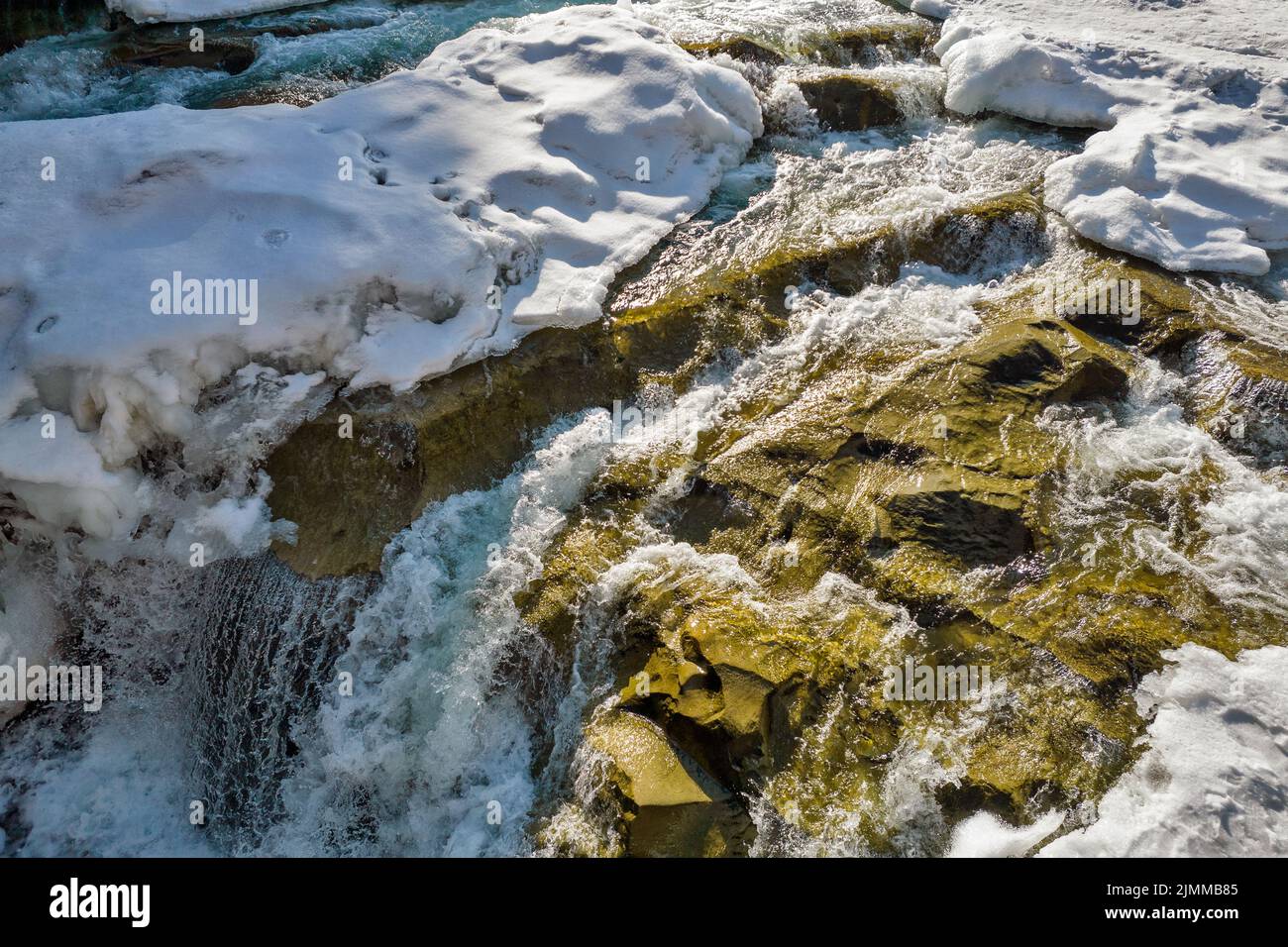 Winter Probiy waterfall closeup on the Prut River, in Yaremche, Ivano-Frankivsk region, Carpathian mountains, Ukraine. Stock Photo