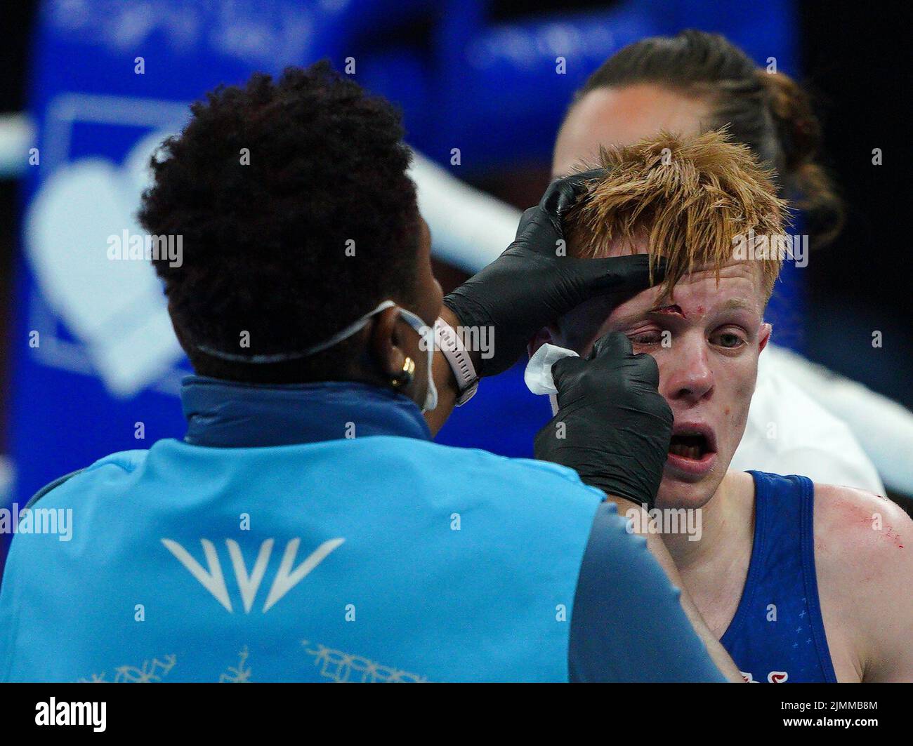 England's Kiaran Macdonald (Blue) with a cut above the eye in the bout against India's Amit Panghal (Red) in the Men's Fly (48-51kg) Final at The NEC on day ten of the 2022 Commonwealth Games in Birmingham. Picture date: Sunday August 7, 2022. Stock Photo
