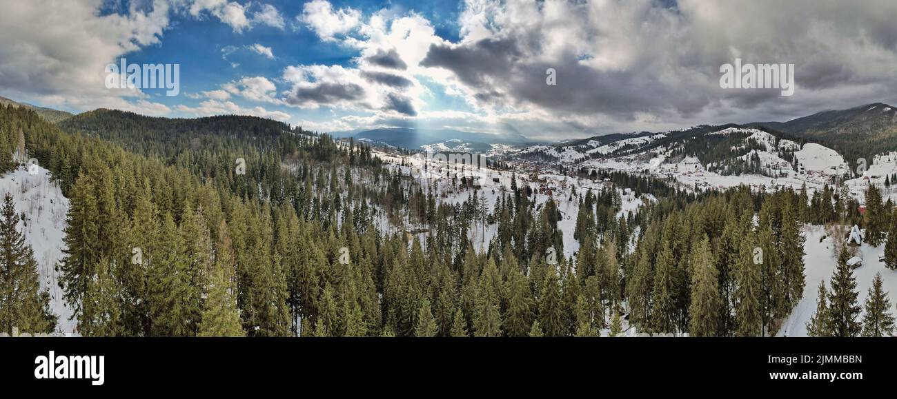 Mountains range panorama of winter resort Vorokhta in Carpathian Mountains, Ukraine. Drone view. Stock Photo