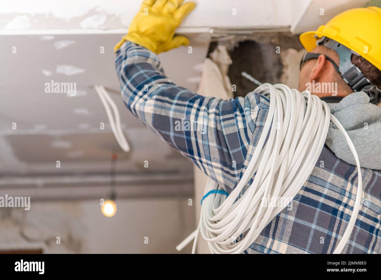 Fully Equipped Professional Electrician Checking and Preparing Space