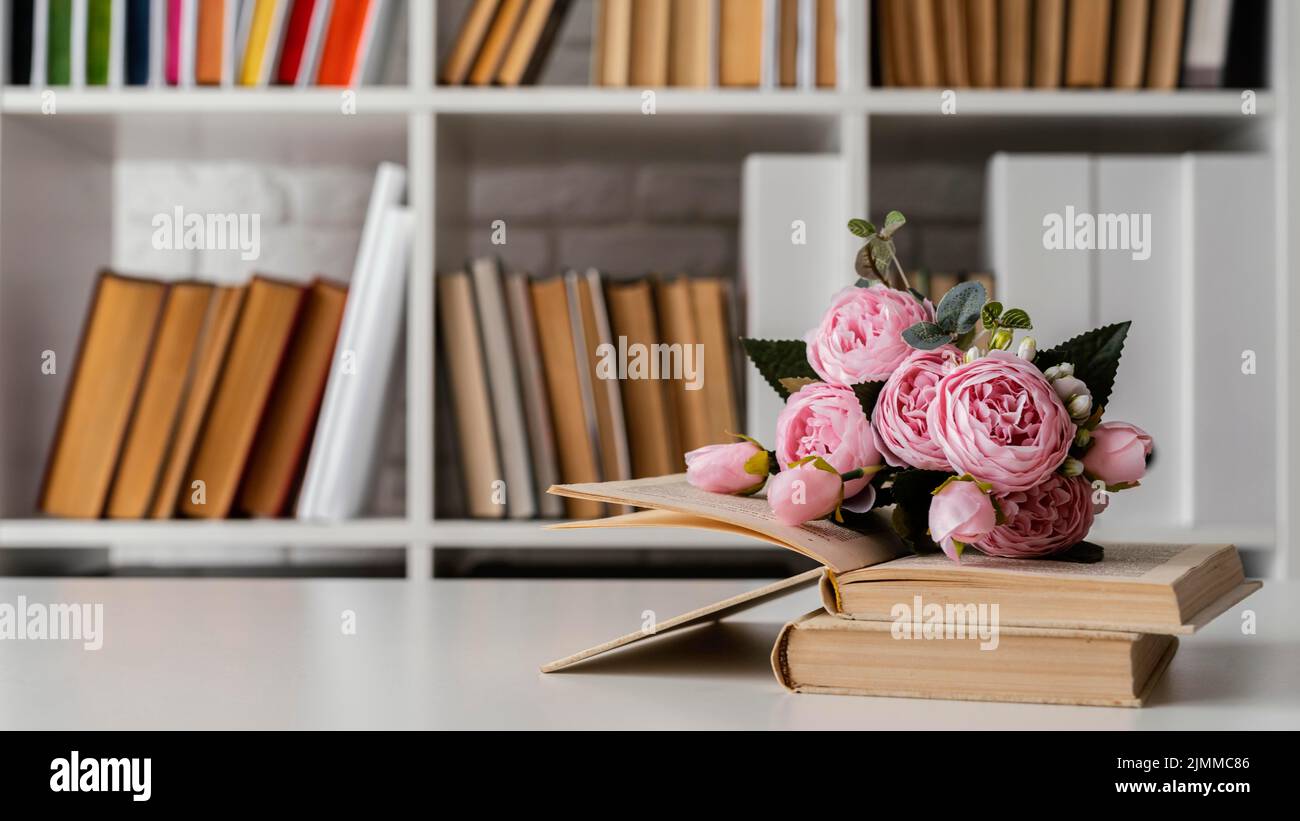 Books shelf flowers arrangement Stock Photo Alamy