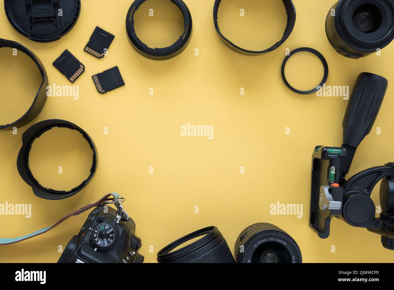 Professional dslr modern camera with camera accessories yellow