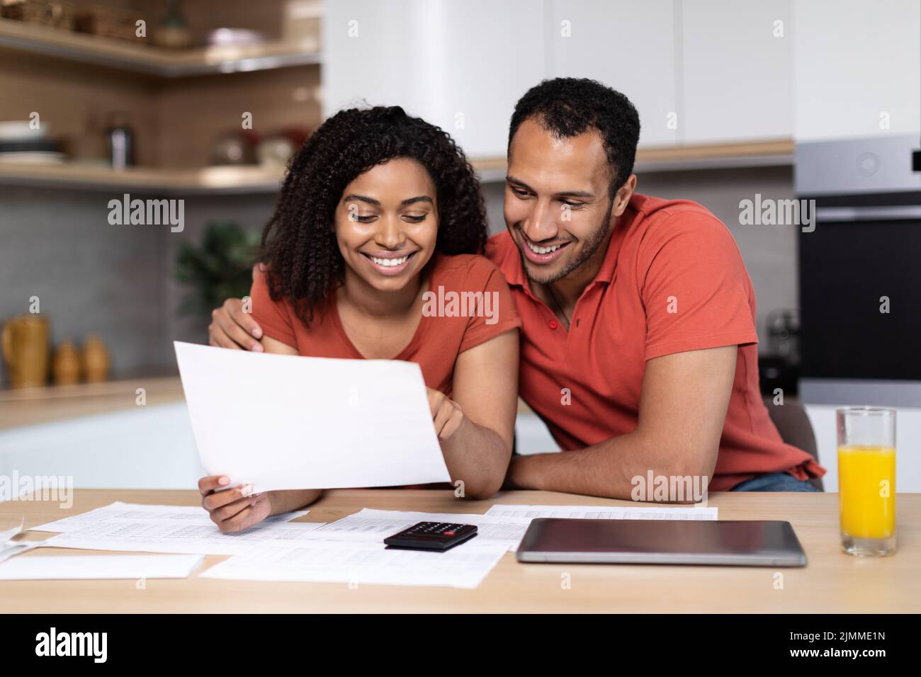 Smiling millennial african american wife and husband in same t-shirts ...