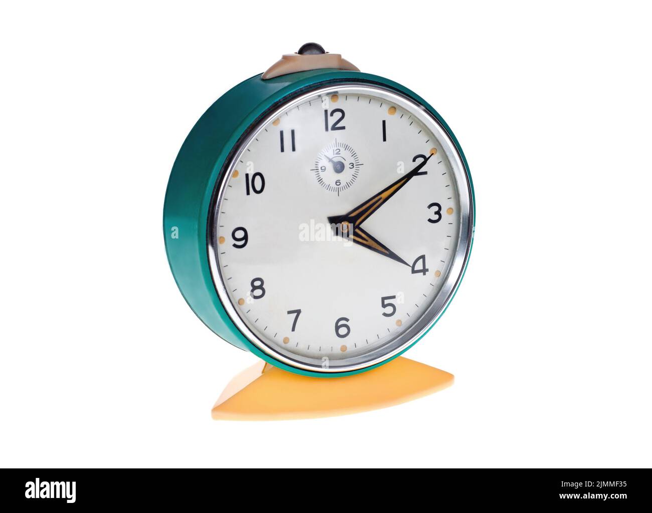 Old metal alarm clock on a white background Stock Photo - Alamy