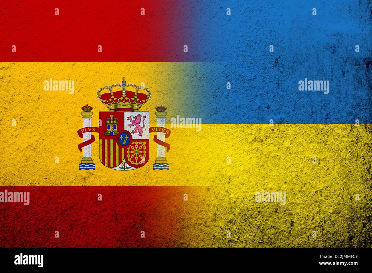 Kingdom of Spain National flag with National flag of Ukraine. Grunge background Stock Photo