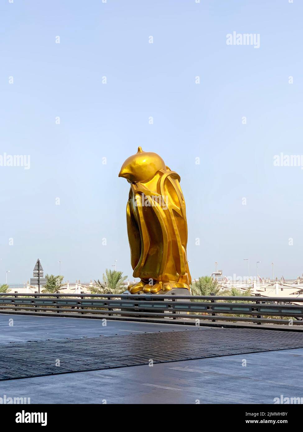 Doha, Qatar - 25th May 2022: The gold Falcon sculpture, by Tom Claassen, outside of the Hamad International Airport, Doha. Installed in 2021 and repre Stock Photo