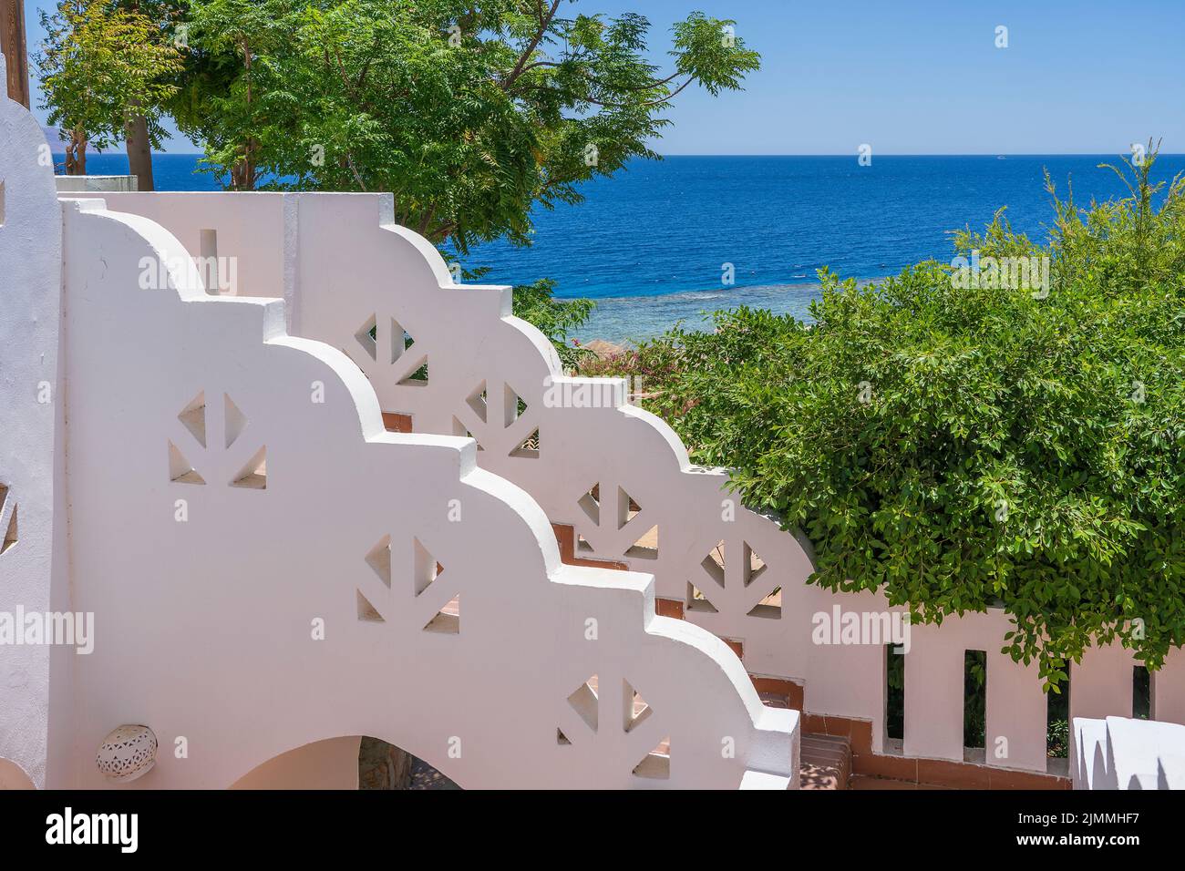 Detail of stairs and white wall of a house on the street of Egypt in