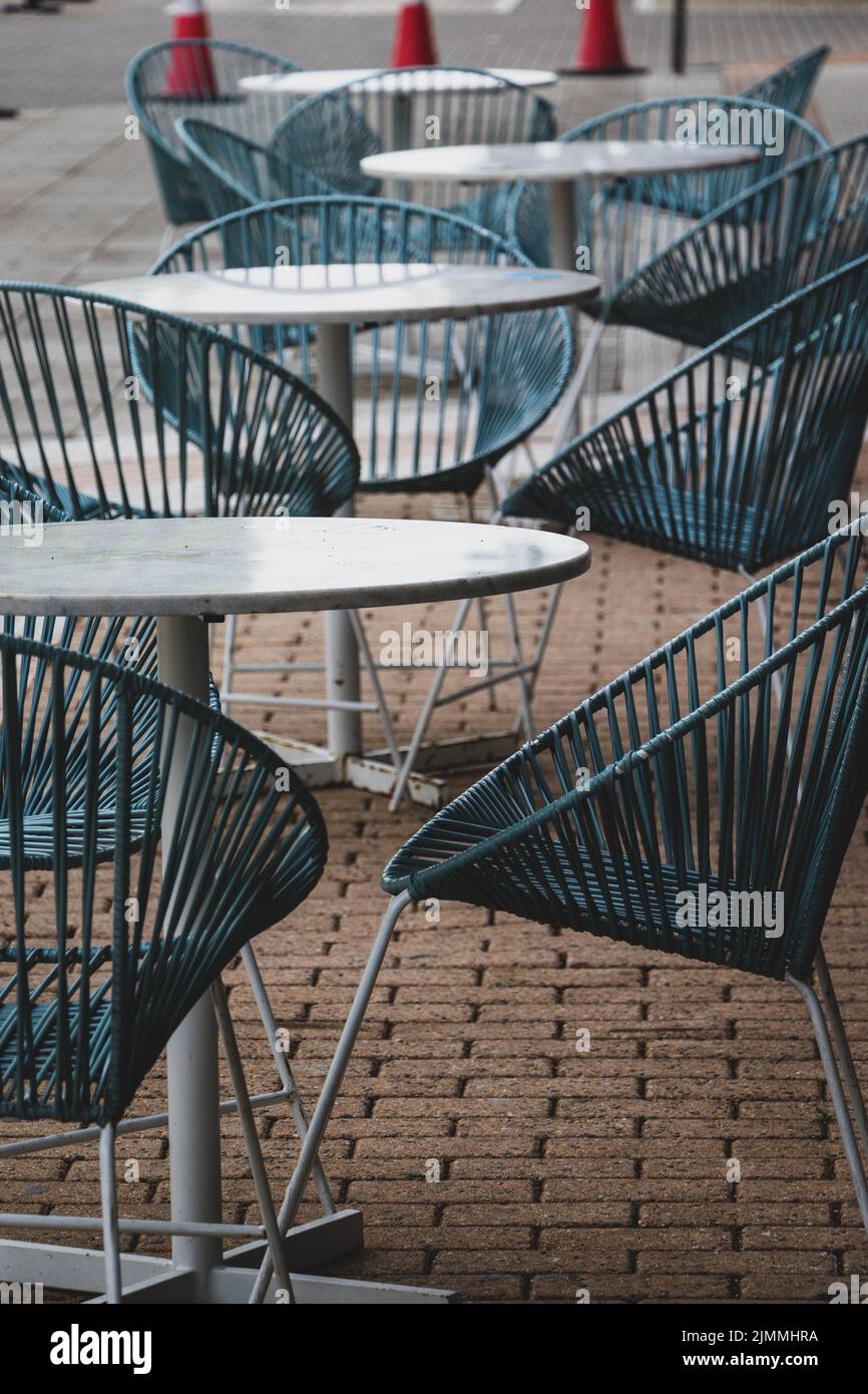Cafe Table Photo A vertical shot of cafe tables and chairs Stock Photo - Alamy