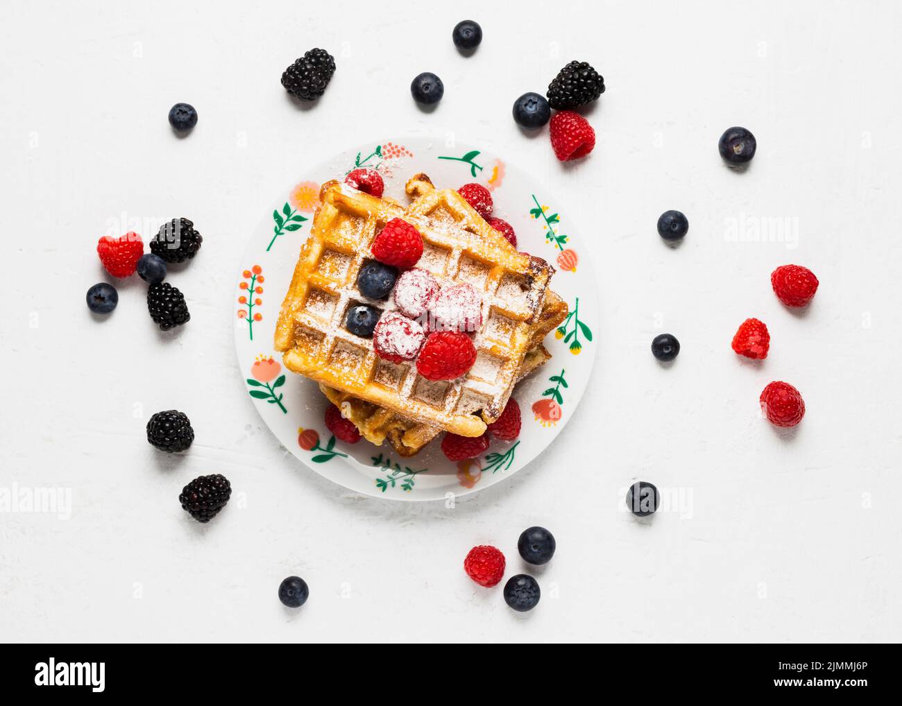 Creative breakfast with waffles wild berries Stock Photo Alamy