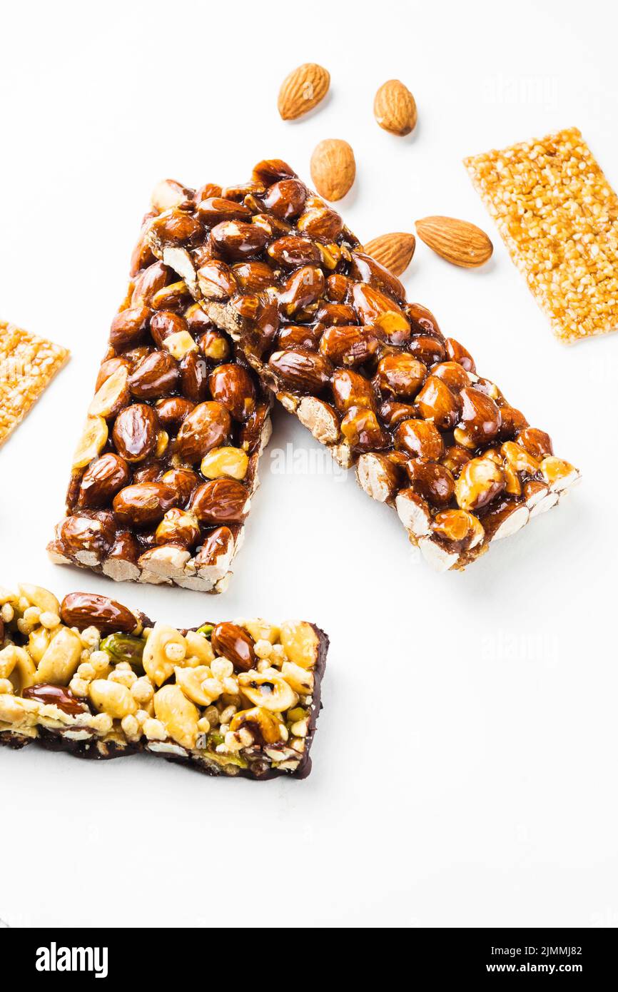 Granola sesame seed almonds bars white background Stock Photo Alamy