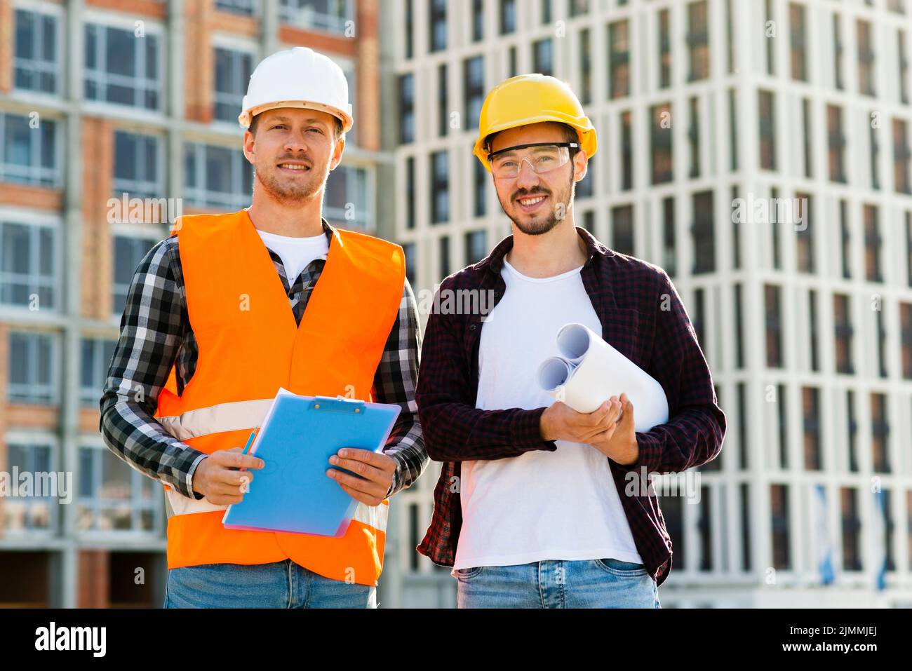 Medium shot engineer architect looking camera Stock Photo