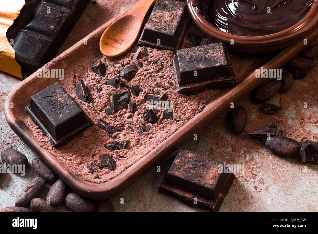 Crushed bar chocolate cocoa powder with chocolate sauce Stock Photo Alamy
