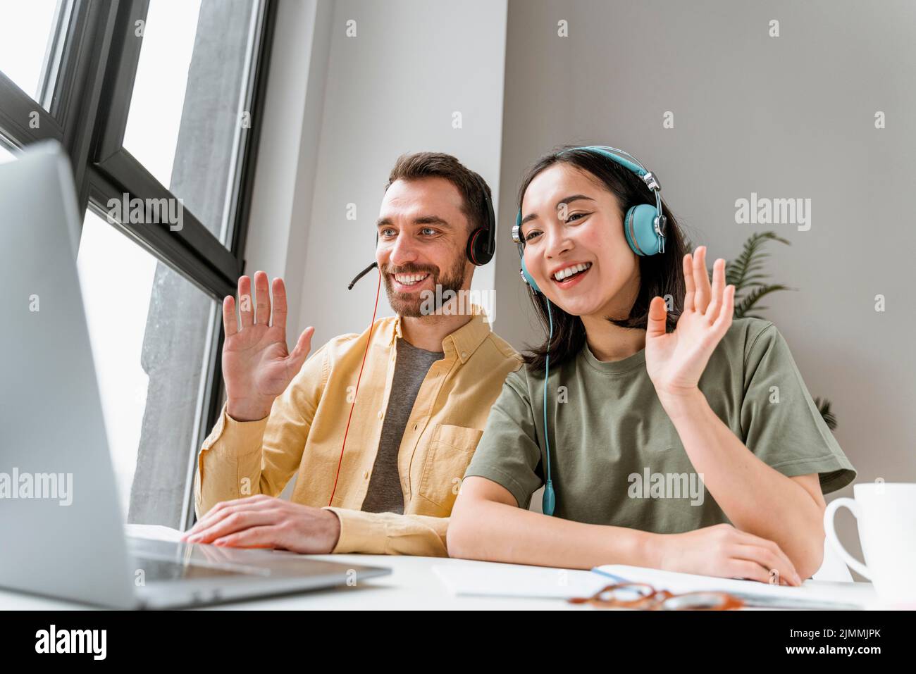 Friends attending online classes together Stock Photo