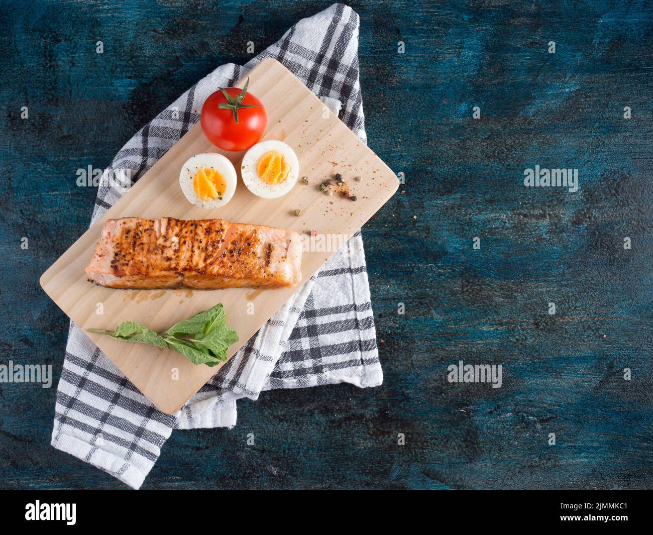 Roasted salmon with boiled egg board Stock Photo