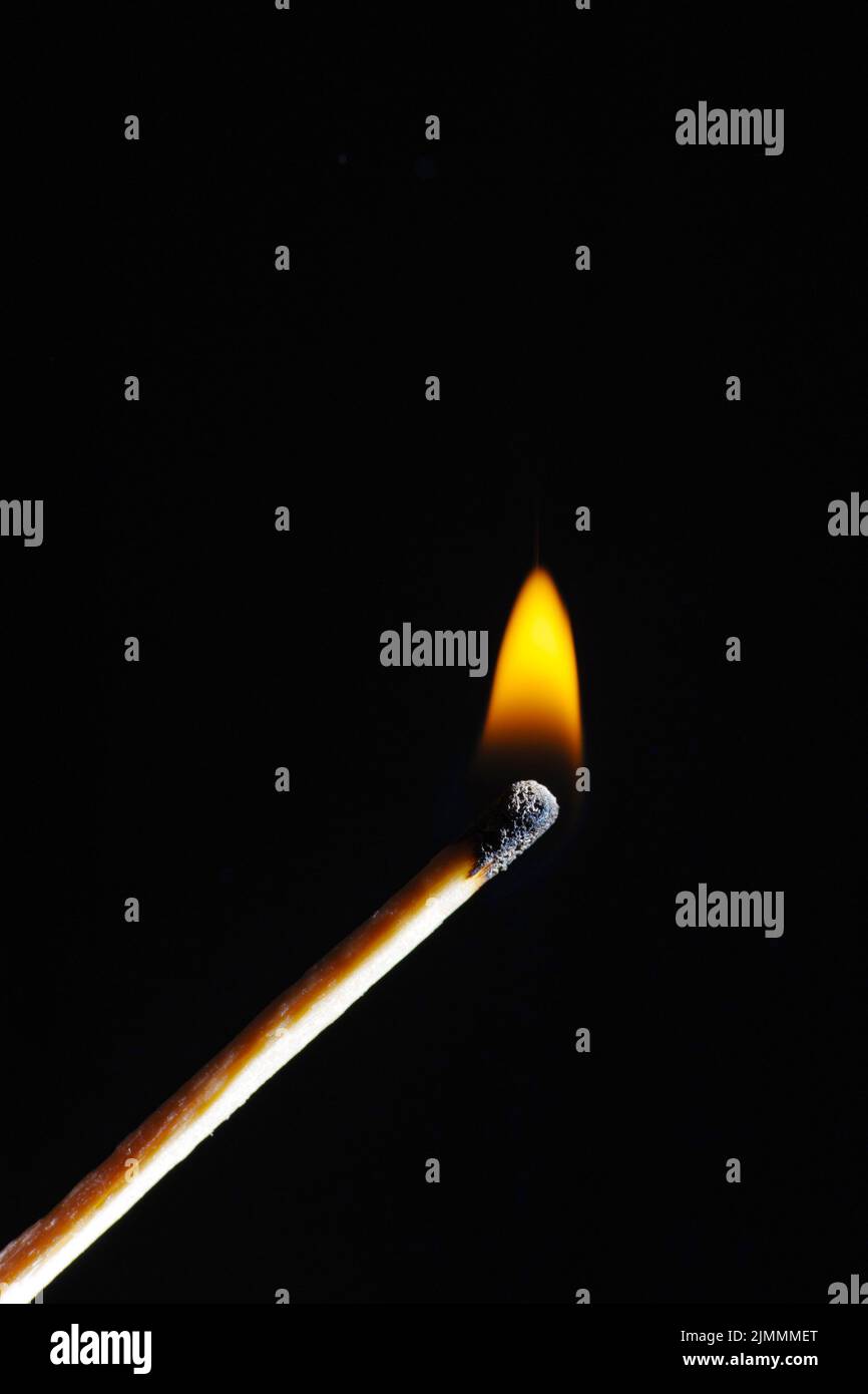 Wooden match on a black background Stock Photo