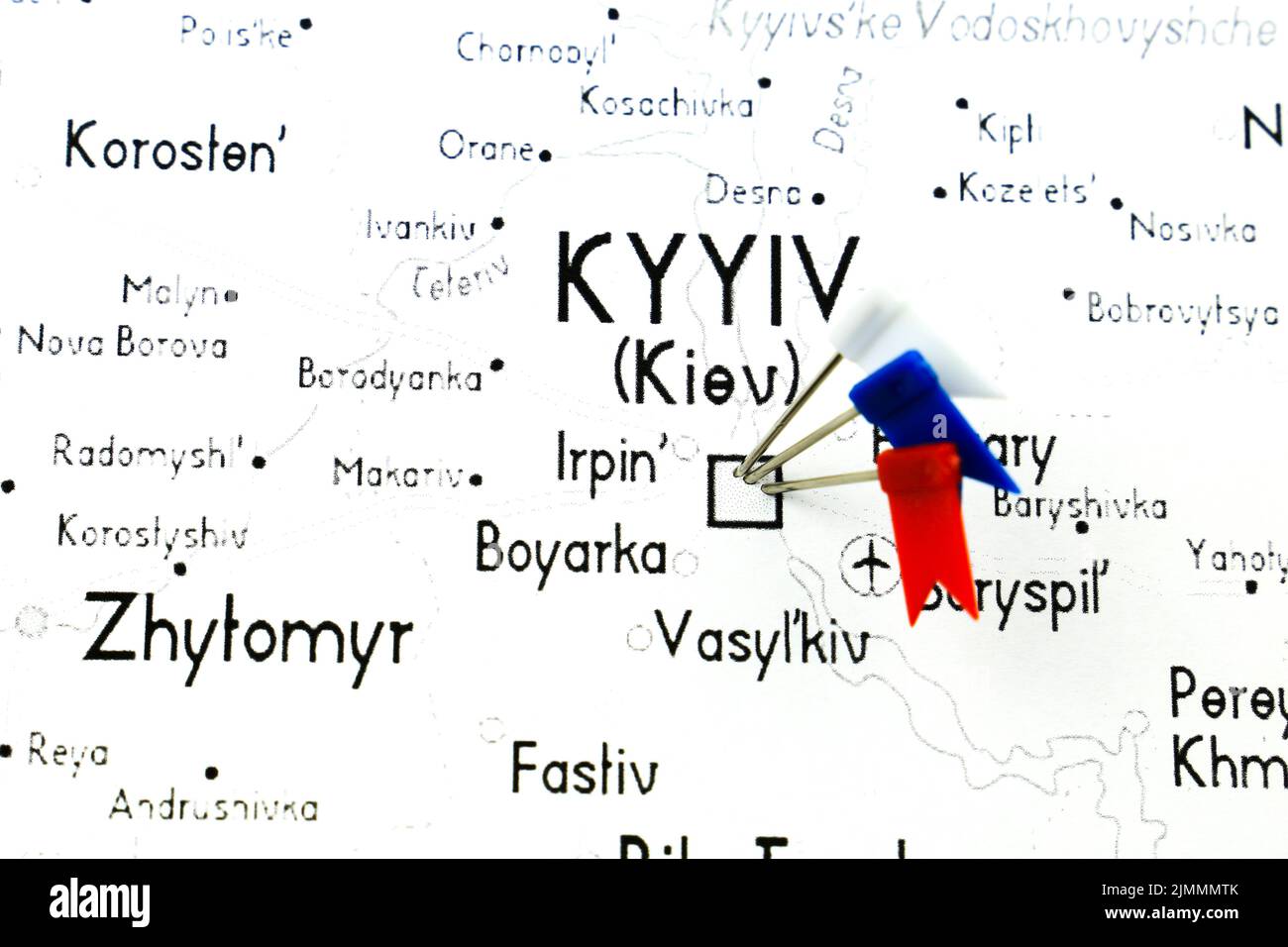 White, Blue and Red pointing flags on Ukraine country on white map Stock Photo