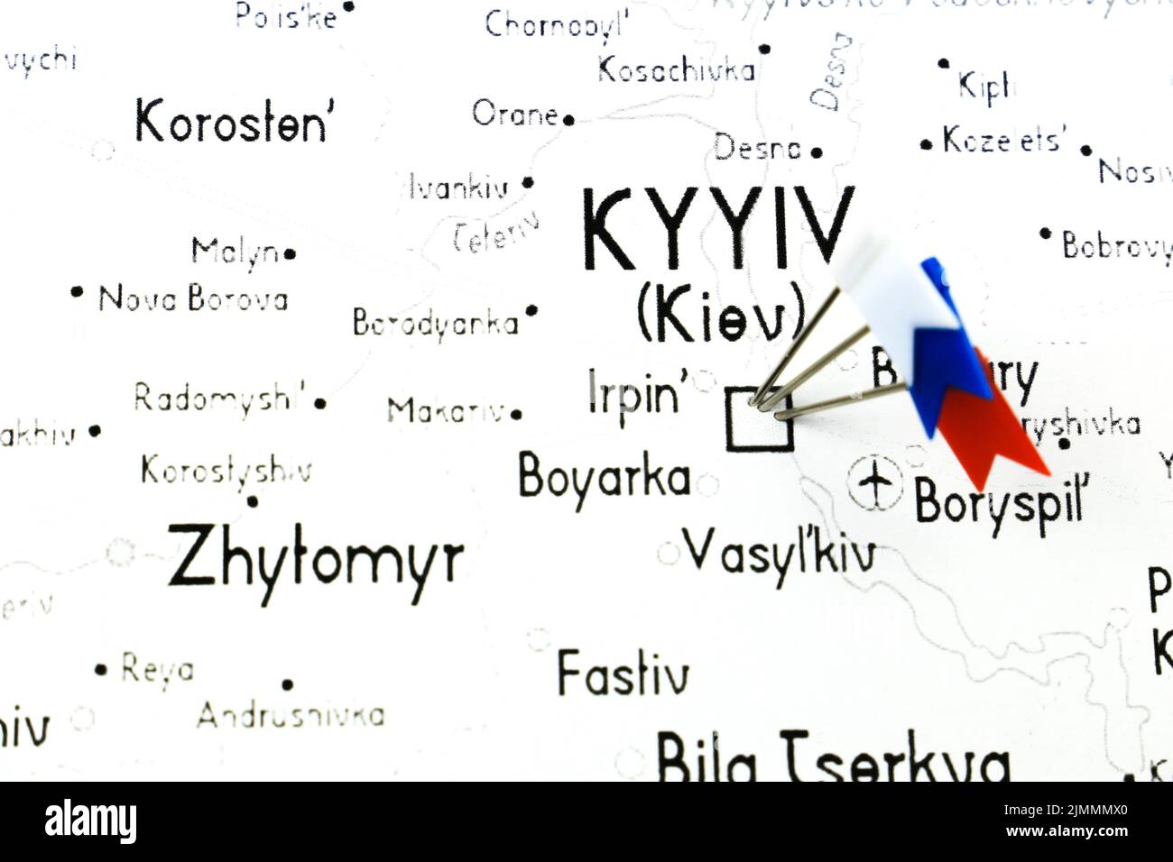 White, Blue and Red pointing flags on Ukraine country on white map Stock Photo