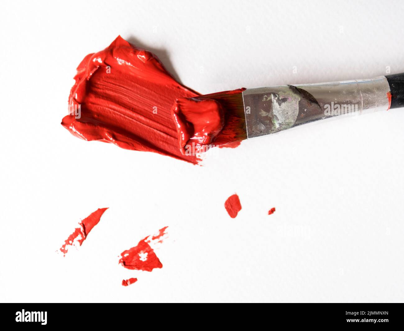 Brush with red paint canvas Stock Photo Alamy