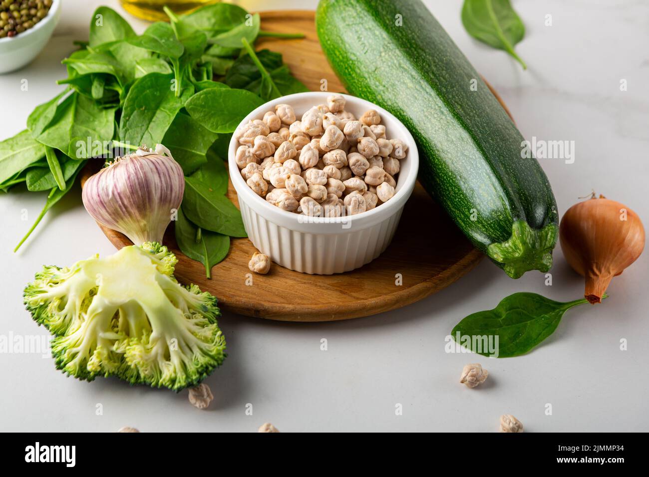 Chick pea and vegetables spinach vegan food cooking ingredients broccoli zucchini Stock Photo