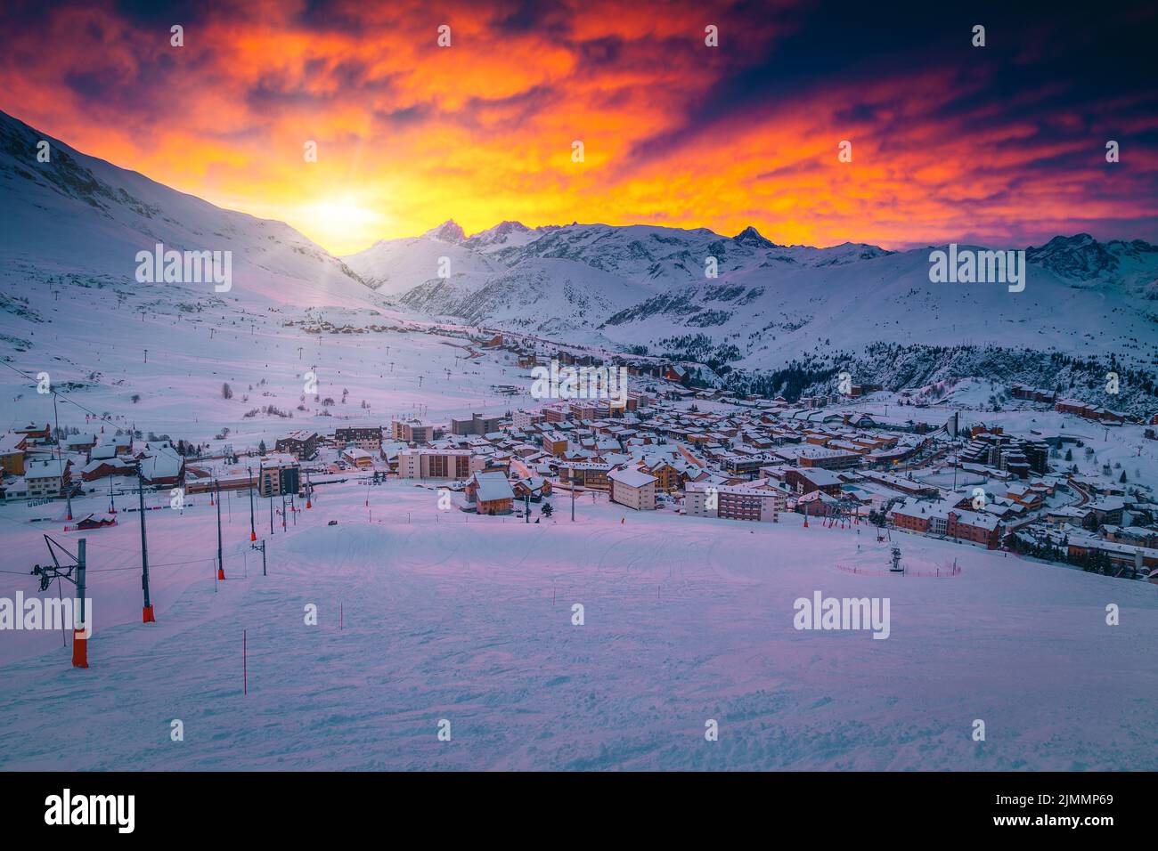Stunning sunrise scenery with majestic colorful clouds over the ski resort, Alpe d Huez, France, Europe Stock Photo