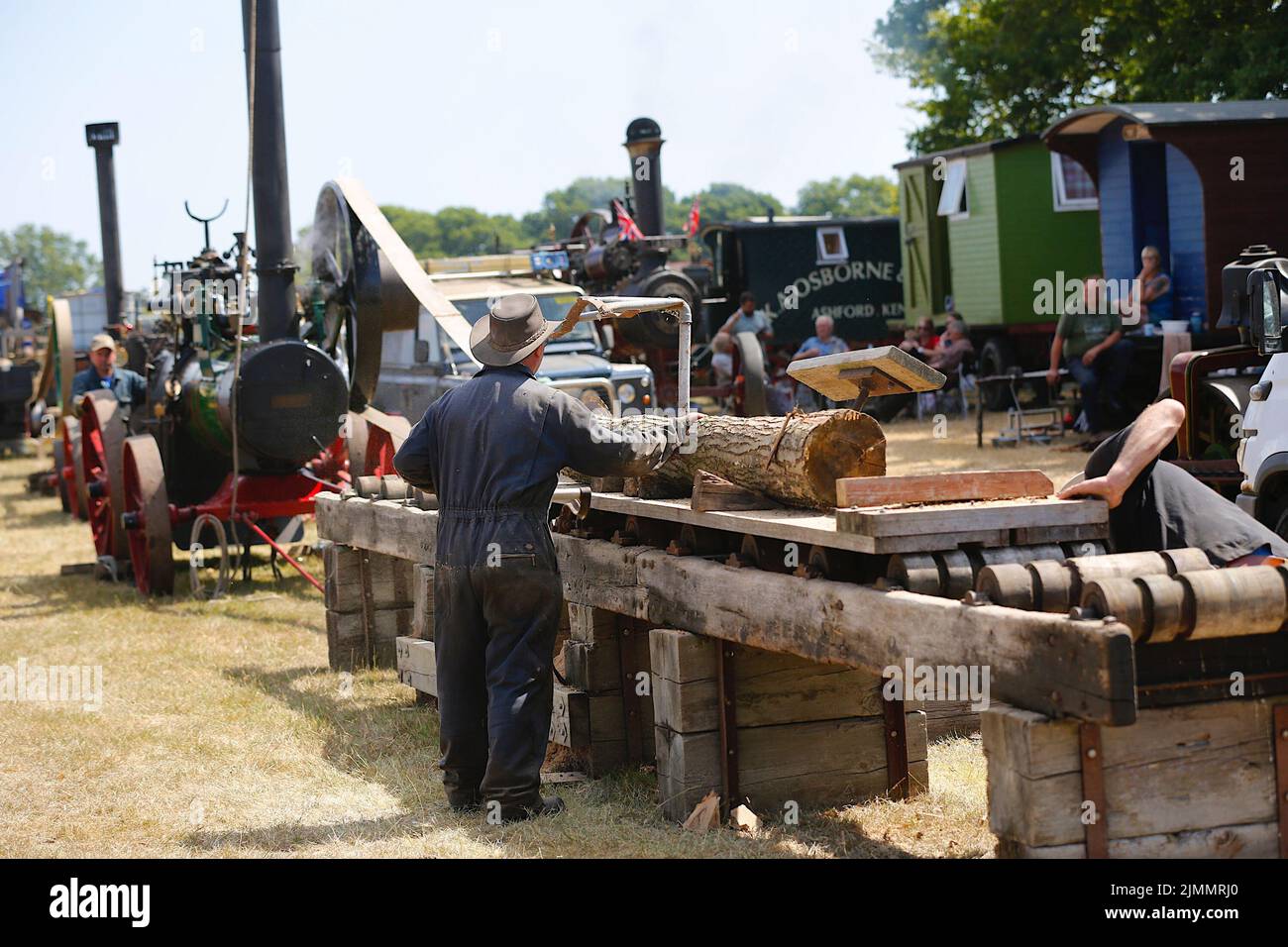 Woodchurch, Kent, UK. 07 August, 2022. On a hot and sunny day in the Kent countryside thousands of people arrive at one of the largest steam rally events in the south east. Logging timber with steam engine. Photo Credit: Paul Lawrenson/Alamy Live News Stock Photo