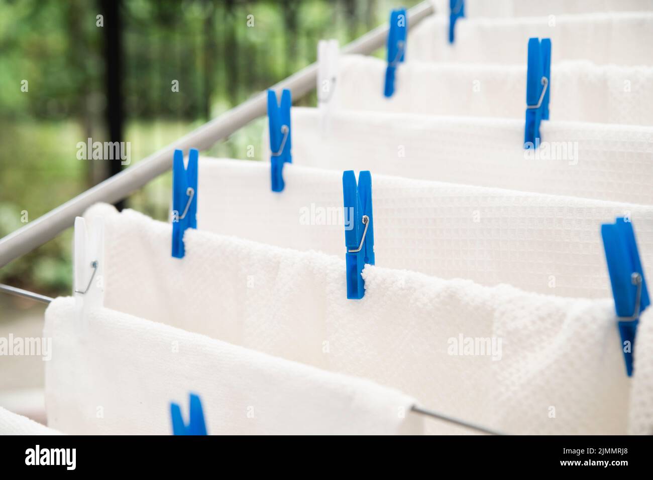 White towels drying clotheshorse Stock Photo
