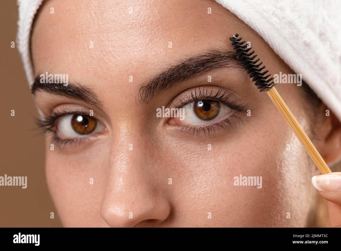 Young woman taking care her eyebrows Stock Photo - Alamy