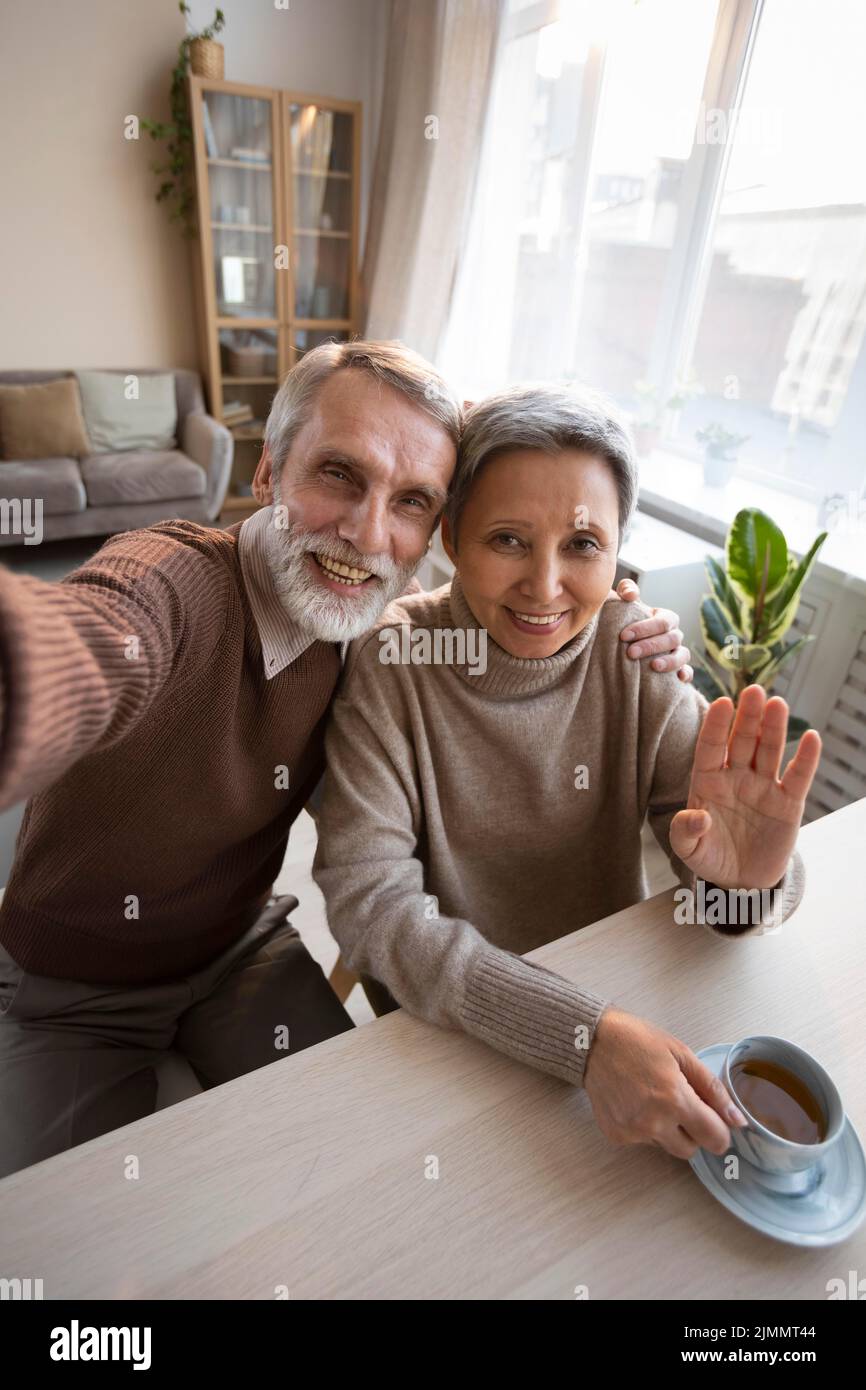 Adorable senior couple taking selfie Stock Photo