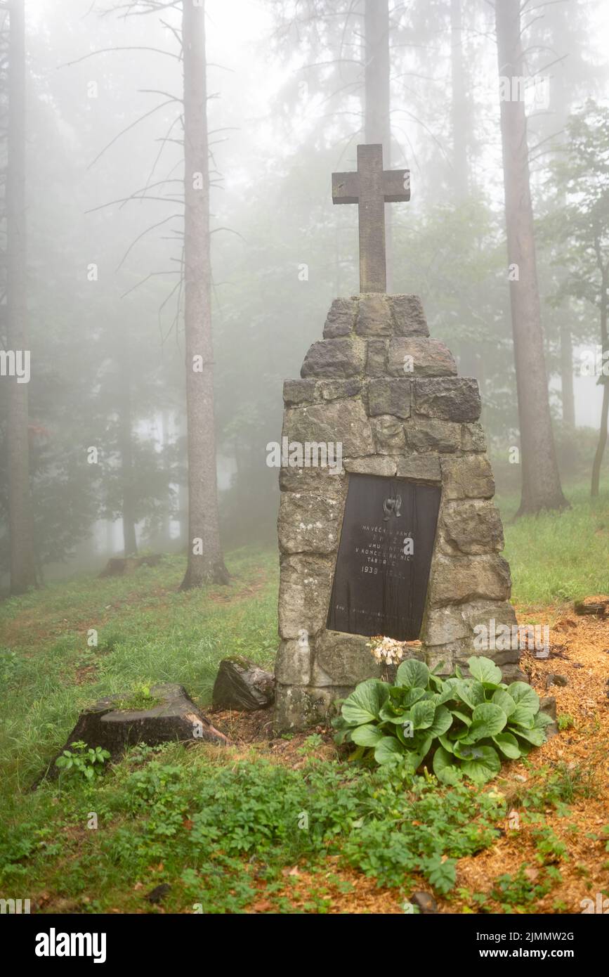 Memorial to priests, who died in Nazi concentration camps. Located at Catholic holy place of Mount Hostýn, Moravia. Rainy, misty weather. Stock Photo