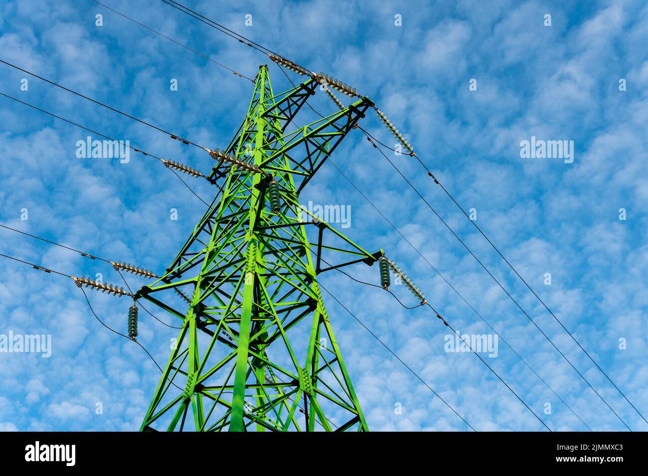Green transmission tower and beautiful blue sky Stock Photo