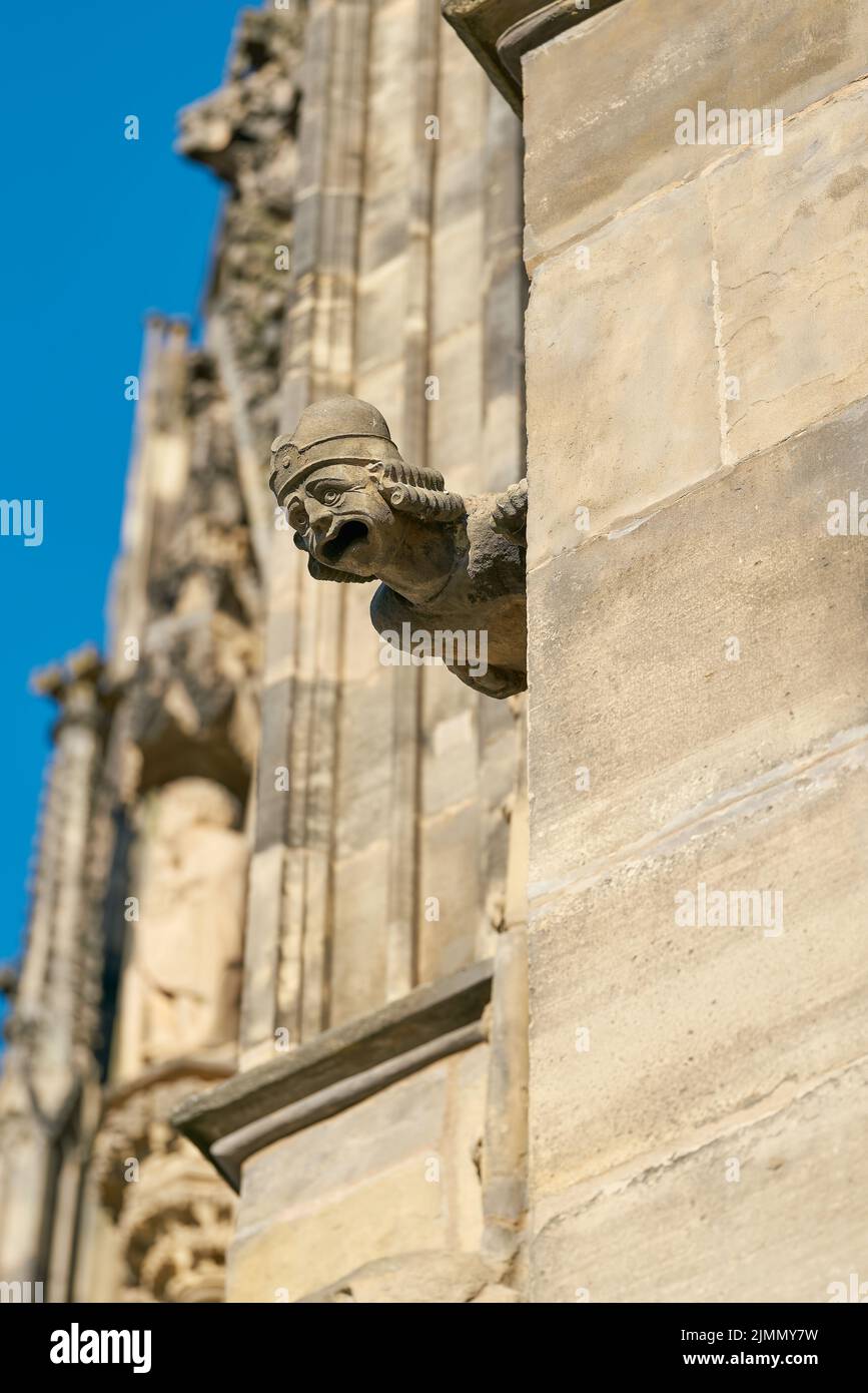 Sandstone gargoyle on the medieval facade of the Gothic Magdeburg Cathedral in Germany Stock Photo