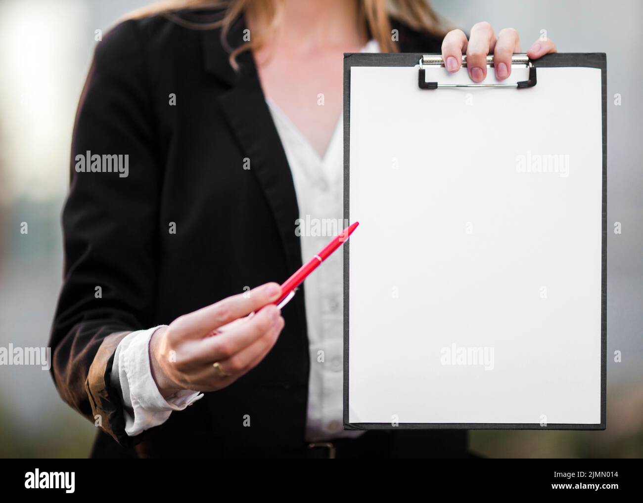 Close up woman showing clipboard mock up Stock Photo Alamy