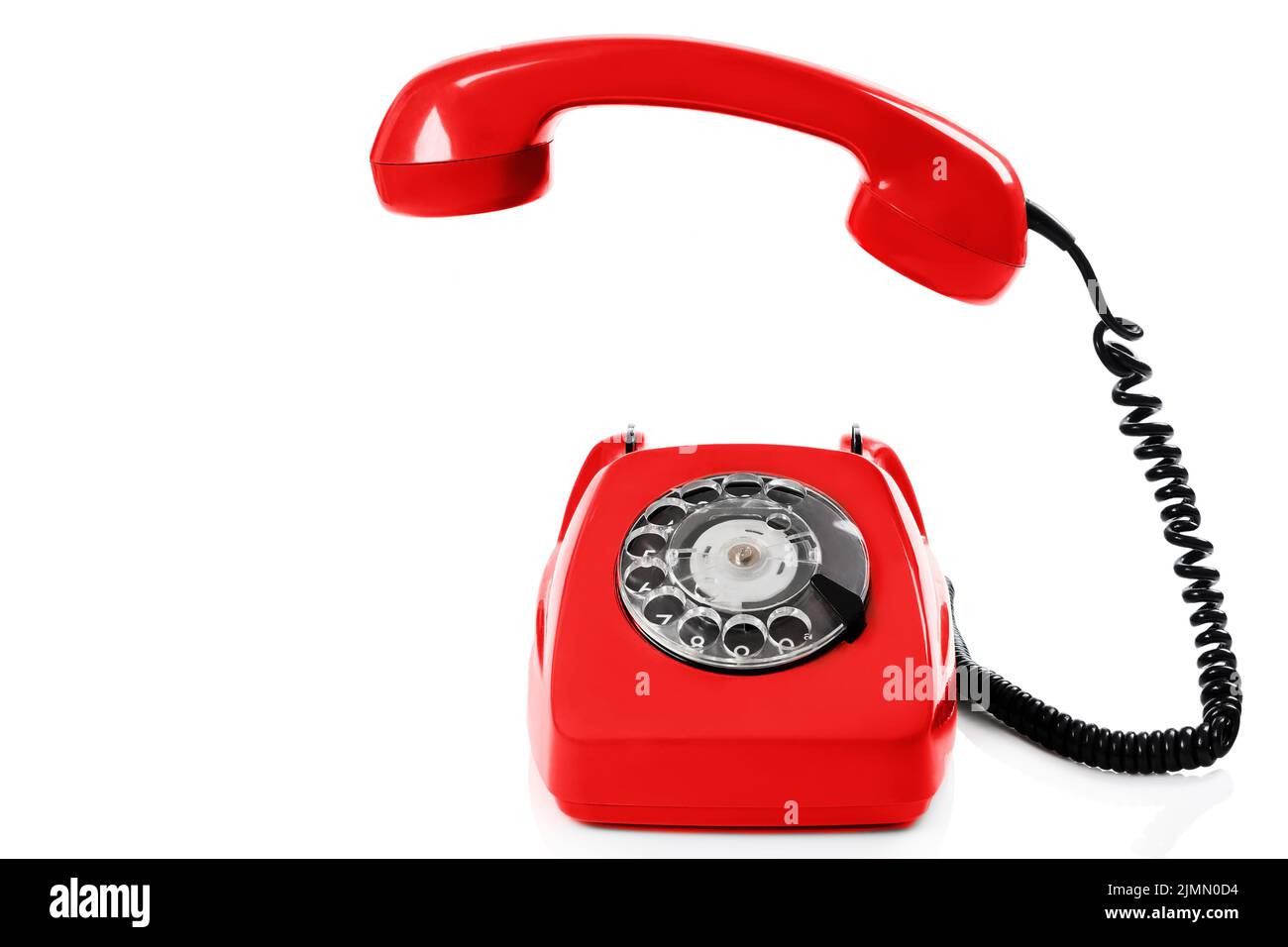 Old fashioned retro red telephone isolated white background Stock Photo